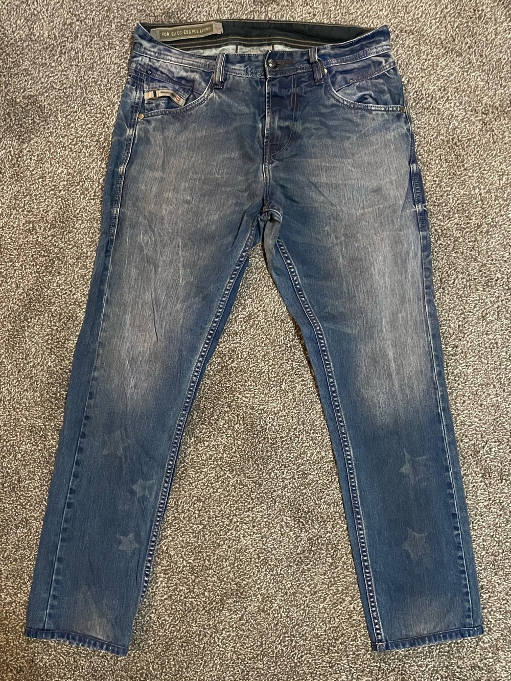 Diesel Men's Faded Blue Slim Jeans with Star Accents